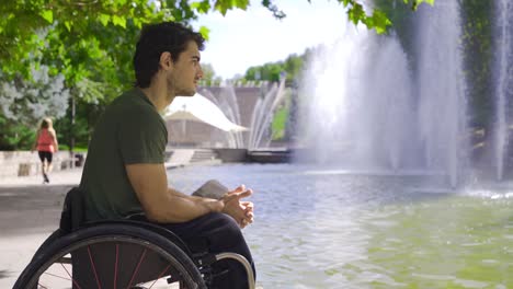 Thoughtful-disabled-teenager.-Thoughtful-young-man-sitting-in-a-wheelchair.